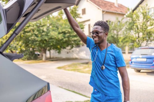 male nurse standing outdoors - travel stock pictures, royalty-free photos & images