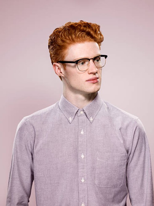 male with wavy red hair and glasses, looking away - fashion stock pictures, royalty-free photos & images