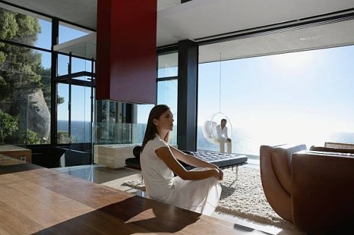 man and woman sitting far apart - home decoration stock pictures, royalty-free photos & images