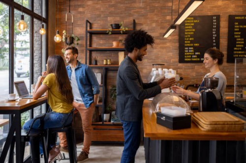 man at a cafe buying coffees to go - junk food stock pictures, royalty-free photos & images
