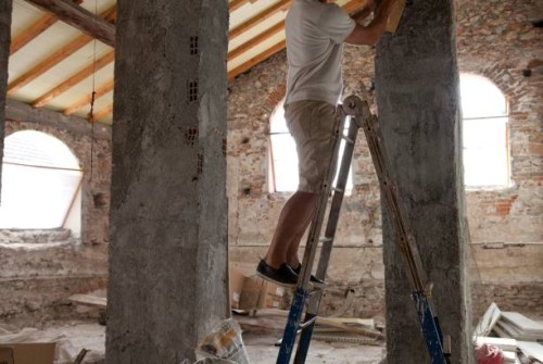 man begins renovation of medieval attic, liguria, italy - home decoration stock pictures, royalty-free photos & images