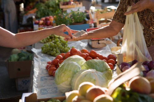 man buying vegetables at outdoors market stall - food stock pictures, royalty-free photos & images
