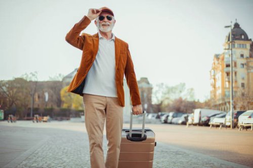 man carrying suitcase - travel stock pictures, royalty-free photos & images