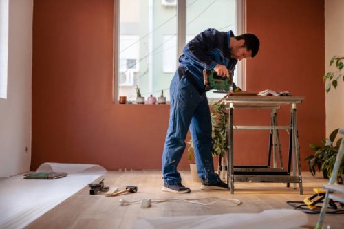 man cutting laminate - home decoration stock pictures, royalty-free photos & images