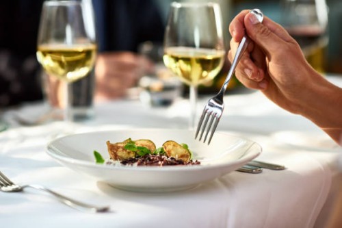 man eating meal at table with fork - food stock pictures, royalty-free photos & images