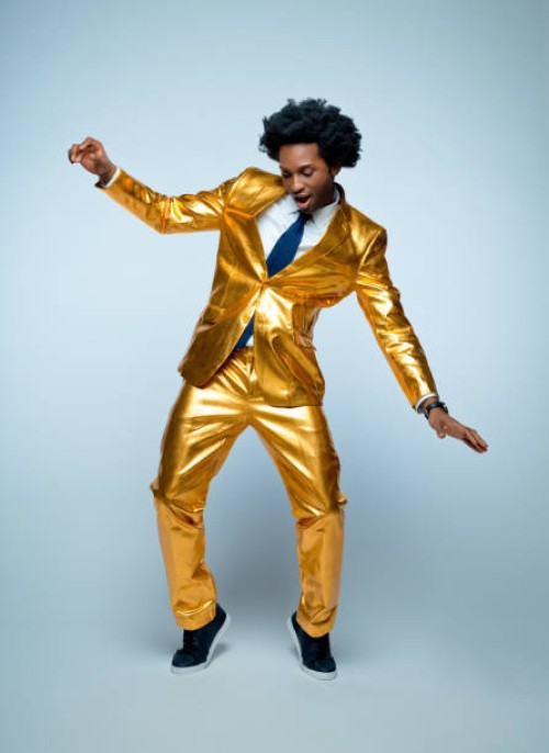 man enjoying and dancing against blue background - fashion stock pictures, royalty-free photos & images
