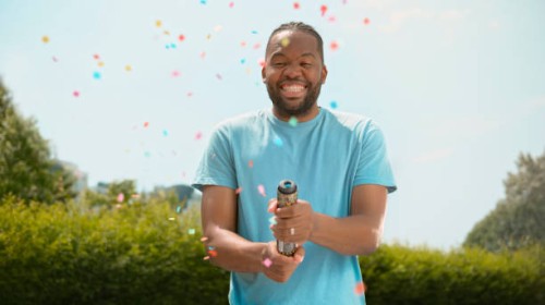 man exploding confetti - garden decoration stock pictures, royalty-free photos & images