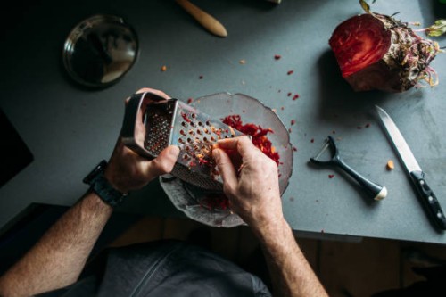 man hand scratching beet - food stock pictures, royalty-free photos & images