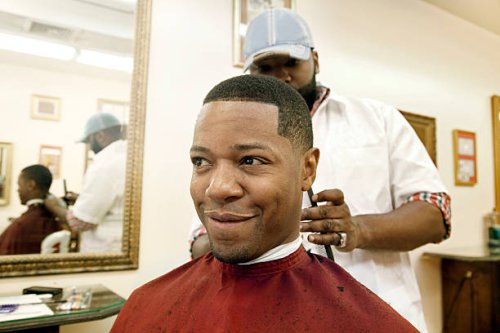 man having hair cut in barber shop - hairstyle stock pictures, royalty-free photos & images