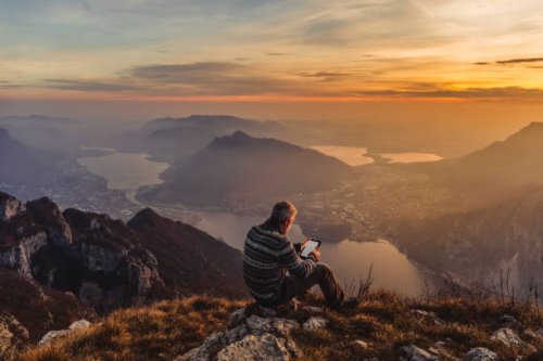 man hiker solo on the mountain during golden hour - travel stock pictures, royalty-free photos & images