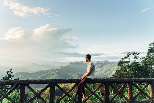 man in mountains at sunset in thailand - travel stock pictures, royalty-free photos & images