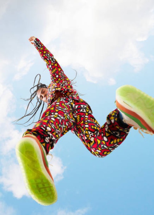 man jumping looking down - fashion stock pictures, royalty-free photos & images