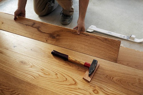 man laying finished parquet flooring, close-up - home decoration stock pictures, royalty-free photos & images