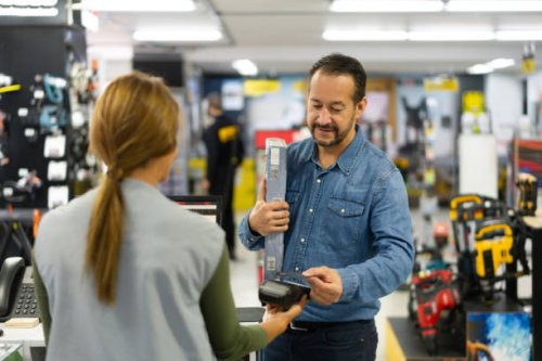 man making a contactless payment at a hardware store - home decoration stock pictures, royalty-free photos & images