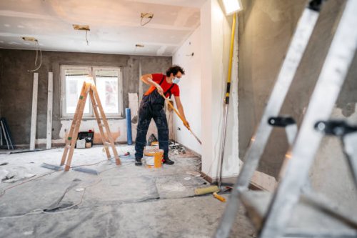 man painting apartment walls - home decoration stock pictures, royalty-free photos & images