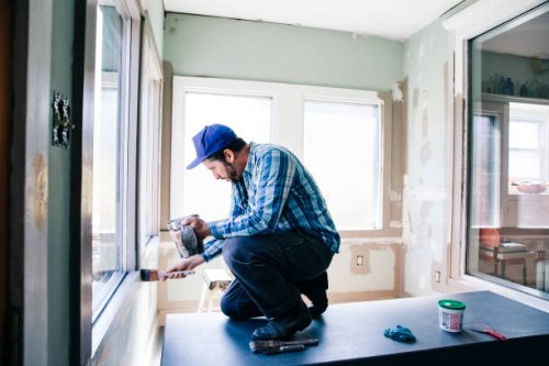 man painting interior window sill at home - home decoration stock pictures, royalty-free photos & images