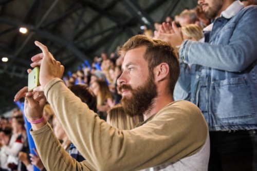 man photographing at a footbal match - concert stock pictures, royalty-free photos & images