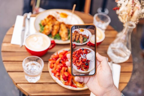 man photographing his breakfast at the cafe using smartphone, personal perspective view - food stock pictures, royalty-free photos & images