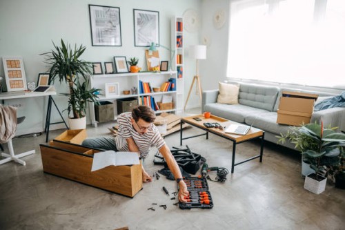 man portrait and do it yourself furniture assembly - home decoration stock pictures, royalty-free photos & images