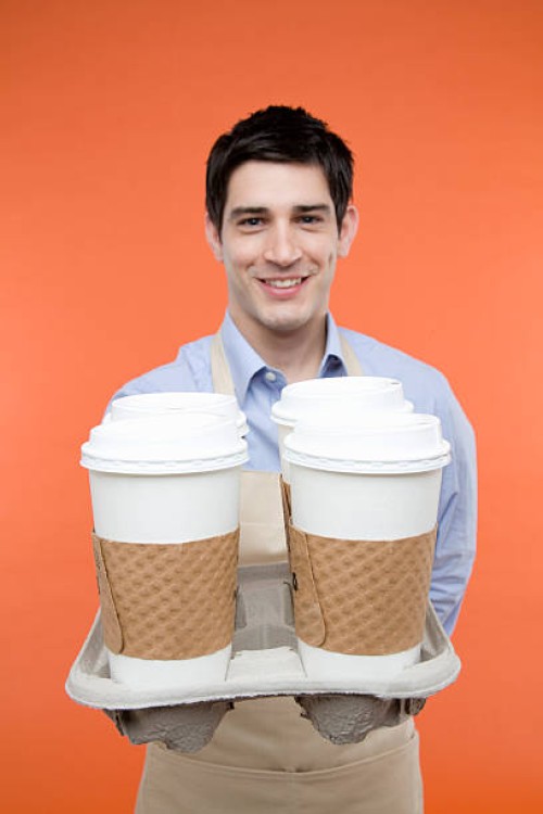 man serving takeout coffee - junk food stock pictures, royalty-free photos & images