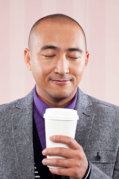 man smelling coffee aroma - junk food stock pictures, royalty-free photos & images