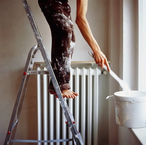 man standing on ladder painting - home decoration stock pictures, royalty-free photos & images