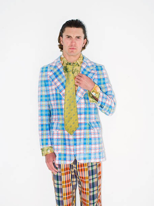 man wearing 1980s plaid jacket and pants - fashion stock pictures, royalty-free photos & images