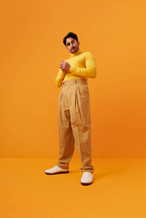 man with vitiligo standing with hands clasped - fashion stock pictures, royalty-free photos & images