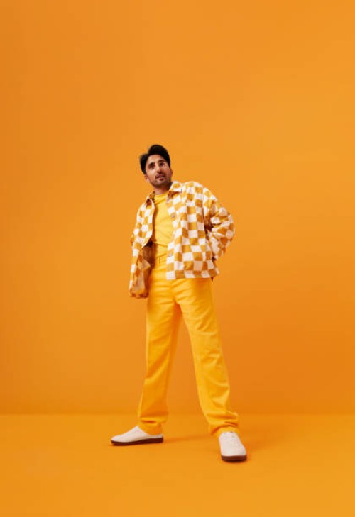 man with vitiligo standing with hands in pockets - fashion stock pictures, royalty-free photos & images