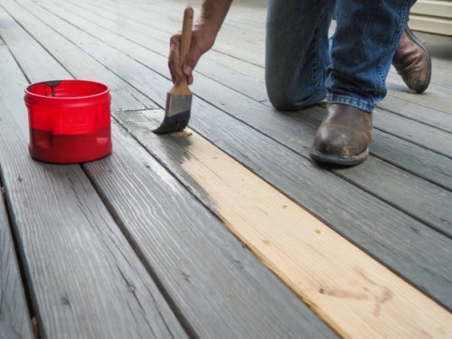 mans hand painting deck close up - home decoration stock pictures, royalty-free photos & images
