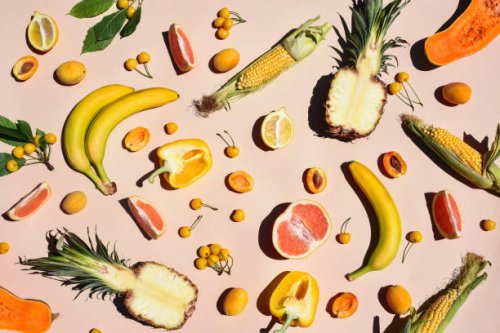many yellow fruits and vegetables on a yellow background. - food stock pictures, royalty-free photos & images