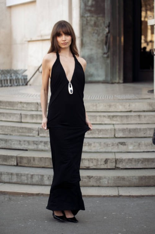 Mara Lafontan wears long black dress outside the Christopher Esber fashion show during the Womenswear Fall/Winter 2025/2026 as part of Paris Fashion...