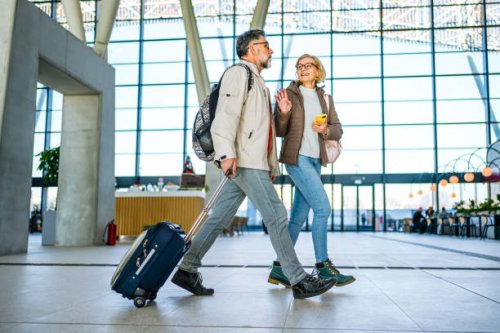 mature couple of passengers at the train station - travel stock pictures, royalty-free photos & images