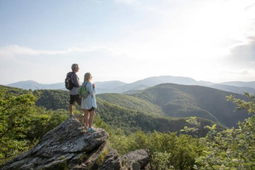 mature hiking couple relax at viewpoint - travel stock pictures, royalty-free photos & images
