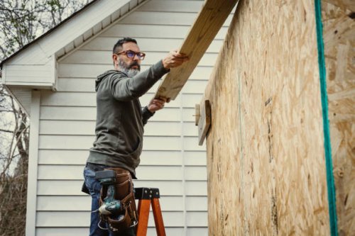 mature man building shed in back yard - home decoration stock pictures, royalty-free photos & images