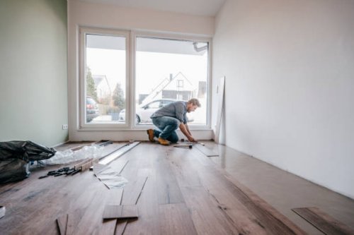 mature man fitting flooring in new home - home decoration stock pictures, royalty-free photos & images