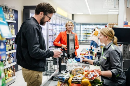mature man paying for groceries at checkout - food stock pictures, royalty-free photos & images