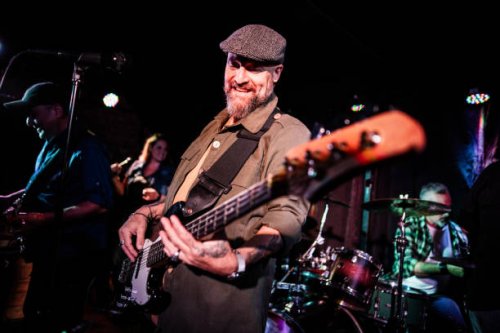 mature man playing guitar during show at night club - concert stock pictures, royalty-free photos & images