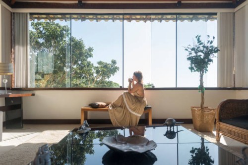 mature woman drinking by hotel window - fashion stock pictures, royalty-free photos & images