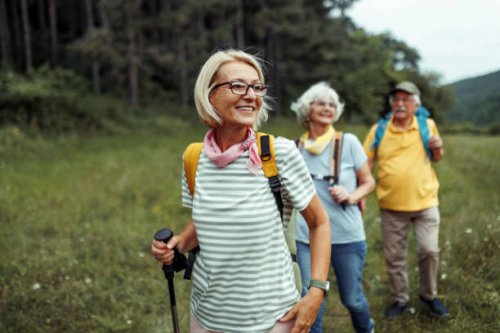 mature woman enjoying her day in forest with friends - travel stock pictures, royalty-free photos & images