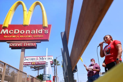 McDonald’s employee Nidia Torres speaks at a rally of fast food workers and supporters for passage of AB 257, a fast-food worker health and safety...