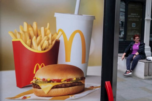 McDonalds double cheeseburger saver meal deal menu beef burger advertising poster on 6th July 2023 in London, United Kingdom.