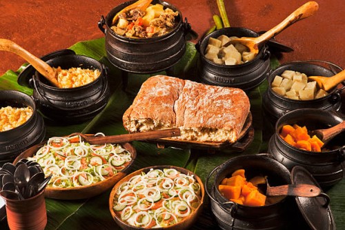 meal served in traditional 3-legged cast iron pots - food stock pictures, royalty-free photos & images