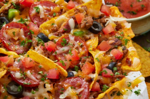 meat lovers pizza nachos - junk food stock pictures, royalty-free photos & images