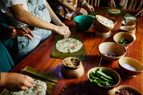 medium close up shot of woman making mayan tamale during cooking class while on vacation - food stock pictures, royalty-free photos & images