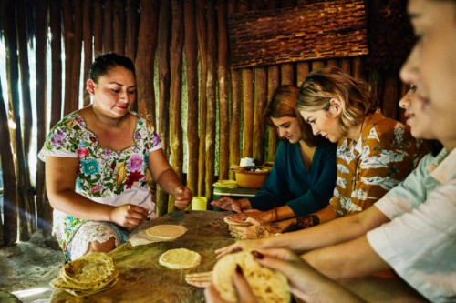 medium shot of women learning how to make tortillas during traditional mayan cooking class - food stock pictures, royalty-free photos & images