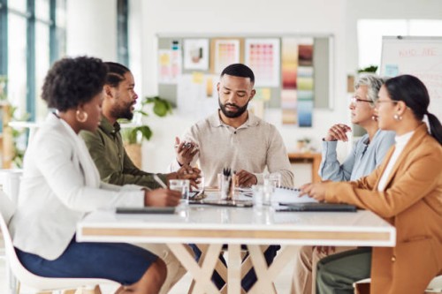 meeting, planning and creative team working on a project together in the boardroom in the office. brainstorming, diversity and advertising people in discussion on creativity report in workplace. - fashion stock pictures, roya