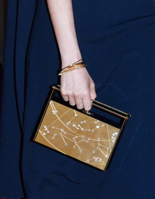 Meghan Markle, clutch bag detail, arrives at the Royal Albert Hall to attend a star-studded concert to celebrate the Queen's 92nd birthday on April...