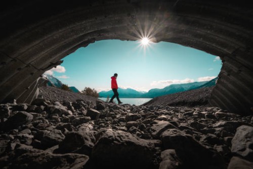 men at secret cave canada abraham lake - travel stock pictures, royalty-free photos & images