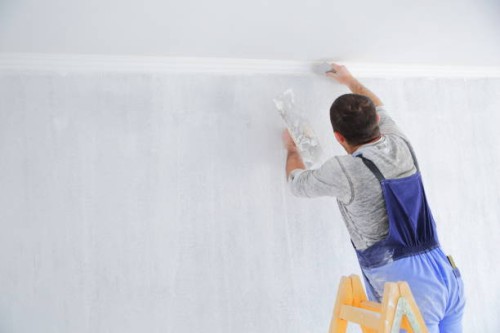 men painting empty home interior - home decoration stock pictures, royalty-free photos & images